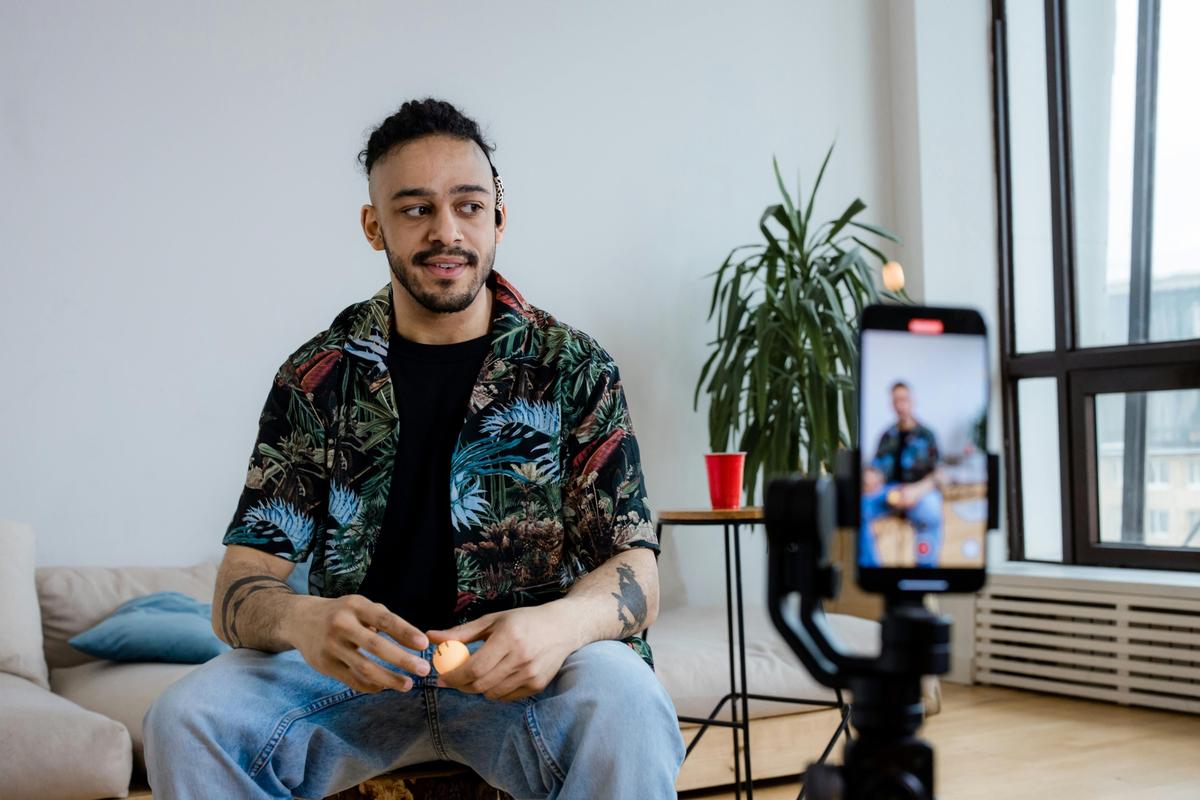 Person filming content on a smartphone